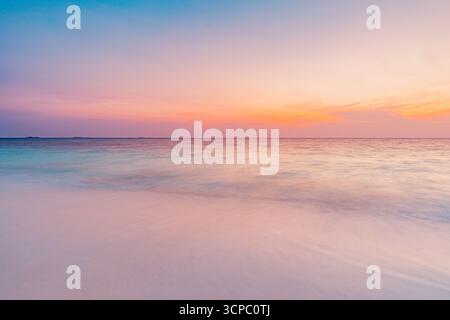 Dreamy colorful sunset sunrise sea on tropical sand beach. Gorgeous seascape, calm waves, inspiring island nature view. Fantastic natural beach shore Stock Photo