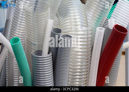 Samples of flexible protection of corrugated pipes in electrical installations in the store. Sale Stock Photo