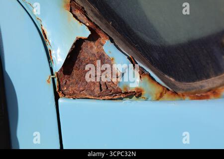 Rusting body in an old car. Weather damage in vehicle. Stock Photo