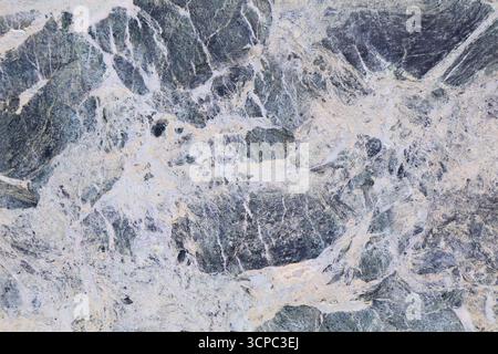 Real stone background. Breccia marble natural stone texture background for use on ceramic tiles or as digital background. Stock Photo