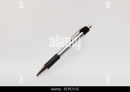 Black and silver-tipped pen on white background. Stock Photo