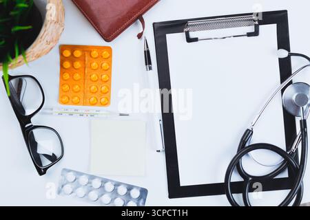 Medical tools and supplies arranged on a table in a health care setting for examination Stock Photo