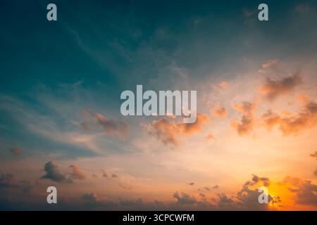 Beauty sunset sky colorful dreamy clouds serene horizon glowing light majestic evening nature backdrop tranquil scenic atmosphere. Peaceful rays beams Stock Photo