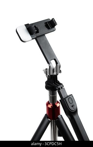 Close-up of a smartphone tripod mount with an attached LED light. Stock Photo