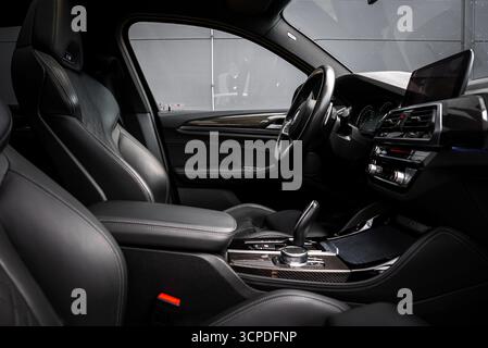 Close Up of BMW X4 Interior with Black Leather Seats and Digital Screen Stock Photo