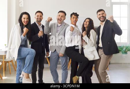 Group Portrait Of Happy Business Team Celebrating Stock Photo