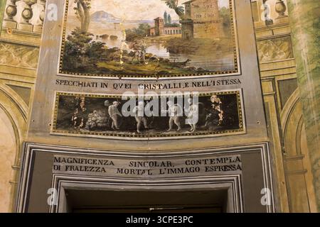 Historic fresco inscription at Villa Palagonia 'Look at yourself in those crystals and contemplate the image of mortal frailty' in the famous 'Villa o Stock Photo