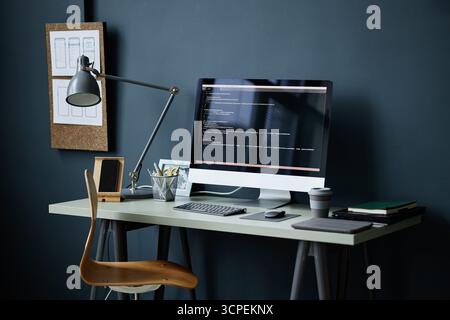 Modern Workspace Featuring Computer Monitor Displaying Programming Code Stock Photo