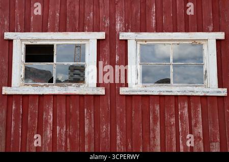 Broken windows on red old building on.Hamburgö island on the western coastline of Sweden, August 2025 Stock Photo
