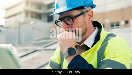 Man, engineer and thinking with tablet in city for solar power installation or sustainable energy. Mature, male person or technician with technology Stock Photo