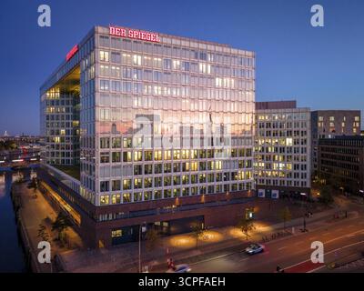 Aerial view of the modern illuminated office building in the city ...