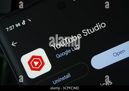 Dhaka, Bangladesh- 27 July 2025: Screen displaying youtube studio app with open and uninstall options, dark interface Stock Photo