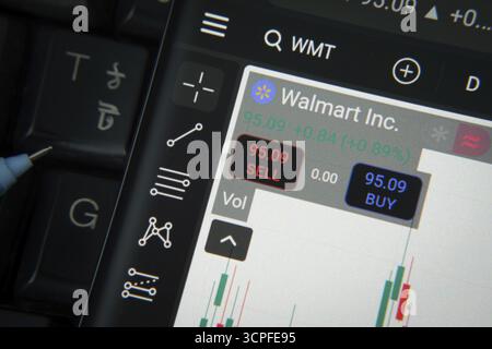 Dhaka, Bangladesh- 20 June 2025: Walmart Inc stock trading details on smartphone over a keyboard Stock Photo