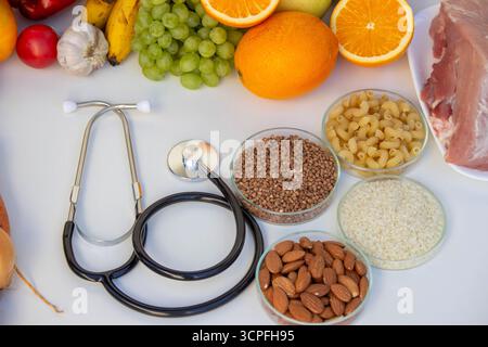 Healthy Eating and Medicine: Stethoscope Fruits Vegetables, and Grains. Stock Photo