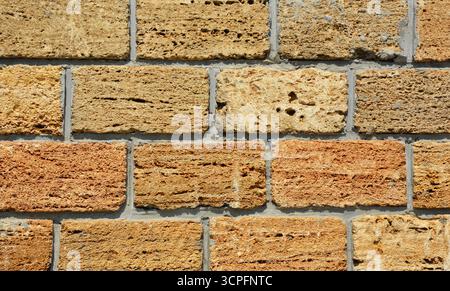 Natural limestone wall texture background from natural limestone blocks Stock Photo