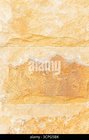 Beautiful stone wall laying in light sand color. natural stone texture. A sample of building material for walls. A copy of the space. layout Stock Photo