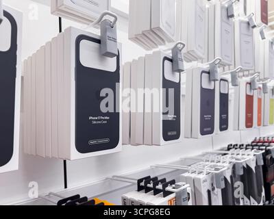 Poznan, Poland - September 20, 2025: Apple iPhone 17 Pro Max Silicone Case boxes are securely displayed on modern white retail shelving, showcasing ph Stock Photo
