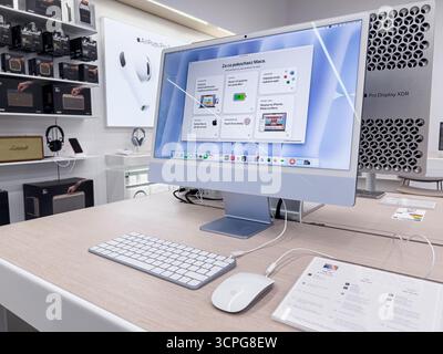 Poznan, Poland - September 20, 2025: Apple Mac computer and Pro Display XDR on a desk in a store, highlighting sophisticated technology, seamless inte Stock Photo