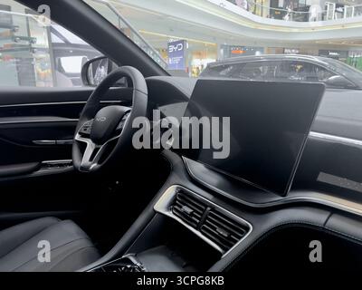 Poznan, Poland - September 20, 2025: Detailing the sophisticated BYD car interior, emphasizing the digital cockpit experience with integrated controls Stock Photo