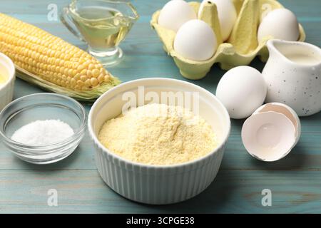 Making cornbread. Different ingredients on light blue wooden table, closeup Stock Photo
