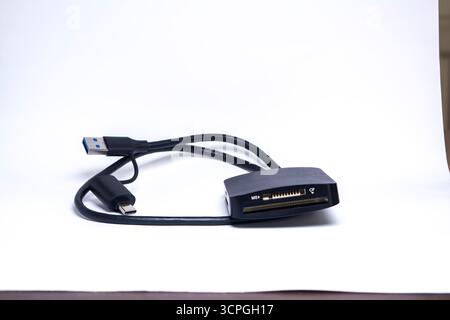 USB Digital Card Reader Isolated on White Background – Compact Multi-Card Adapter for SD, Micro SD, and TF Memory Cards Stock Photo