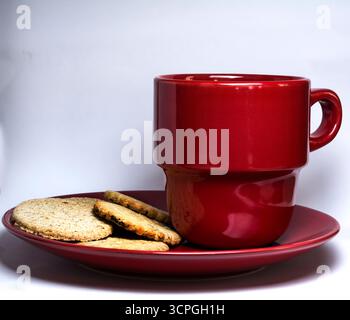Red mug and saucer on white/ cut out background Stock Photo