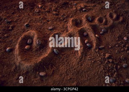 3D word ''coffee'' out of ground coffee and coffee beans from a side angle in perspective Stock Photo