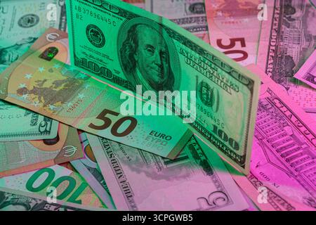 A vibrant assortment of international currency, featuring U.S. dollars and Euros in a colorful, eye-catching arrangement. The image showcases differen Stock Photo