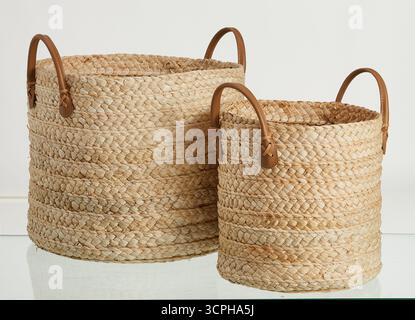 Two natural fiber woven baskets are placed side by side isolated nature background with clipping path Stock Photo