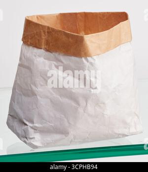 Paper bag with folded top isolated nature background with clipping path Stock Photo