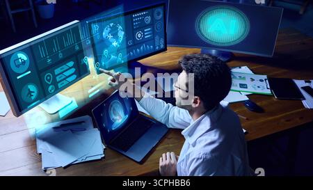 Professional researcher analyzing AI logistics dashboard with futuristic holographic interface. Collage Stock Photo