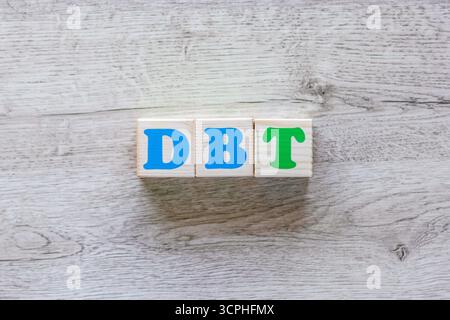Abbreviation DBT on wooden cubes with colorful letters  Stock Photo
