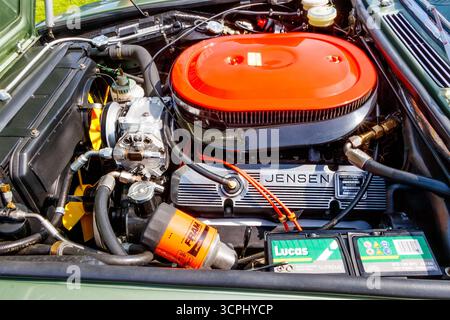 Close-up of a Jensen car engine featuring a prominent orange air filter and detailed components Stock Photo