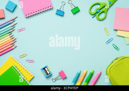 Notepads, pencils, pens, clips for school and art. Flat lay with copy space. Stock Photo