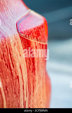 Close up of red car covered in thick soap foam Stock Photo