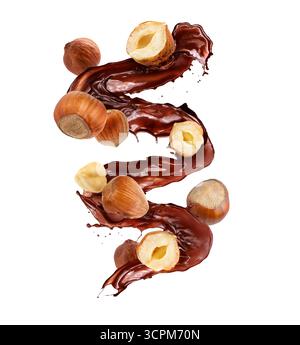 Splash of sweet hot chocolate and hazelnuts on white background Stock Photo