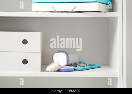 Box with occlusal splint, jaw model and tools on shelf in dentist's office Stock Photo