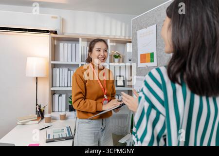 Colleagues working together in a startup meeting, focusing on creative solutions and entrepreneurial strategies that drive innovation, progress, and l Stock Photo