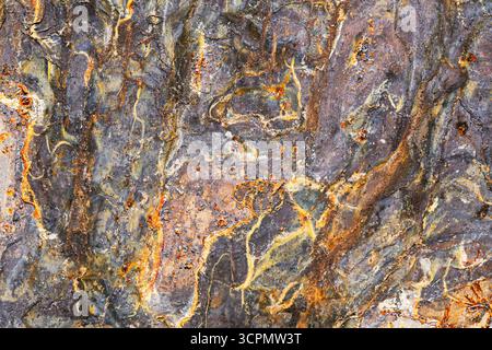 Rust stains and oxidation smudges on old metal surface. Industrial corrosion background with grunge texture. Weathered steel plate closeup. Stock Photo