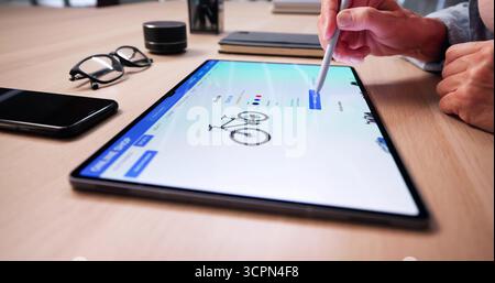 Woman Using Online Ecommerce Shop Featuring Bicycle Stock Photo