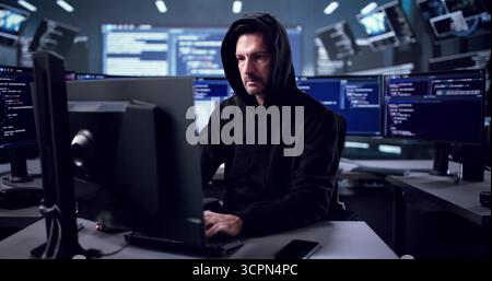 Elderly Man Hacking Computer To Steal Sensitive Data Online Stock Photo