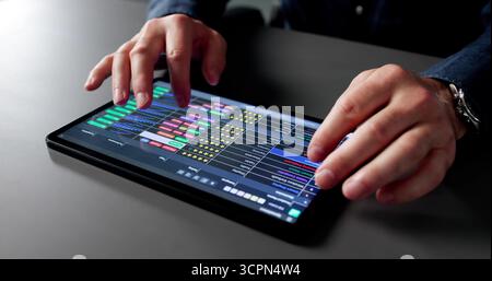 Medical Data Analyst Reviewing Spreadsheets In Office For Business Accounts Stock Photo