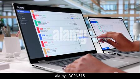 The Elderly Man Is Monitoring System Performance And Providing Technical Support. Stock Photo