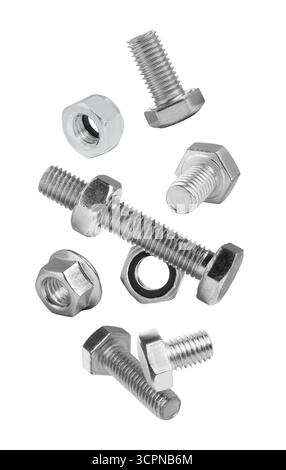 Different bolts and nuts falling against white background Stock Photo
