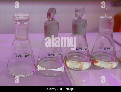 Science experiments in chemistry laboratory. Chemical sciences education concept. Laboratory flasks with liquids Stock Photo