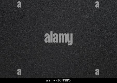Full frame of plastic surface. Dark abstract textured background. Artifical plastic surface with embossing pattern. Background, wallpaper. Stock Photo