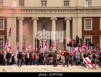 LONDON, UK. 13th August 2025. Unite the Kingdom supporters march to Parliament Square  Waving Union and St Georges Flags. Photo Credit: Ian Humphreys Stock Photo