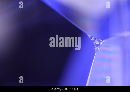 Blue liquid surface, oil stains movement, bright chemistry, surreal background, arctic blue rainbow, water surface, ink and water Stock Photo