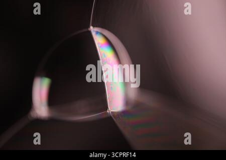 Macro of Iridescent Soap Bubble Cluster with Rainbow Thin Film Interference and Soft Bokeh Stock Photo