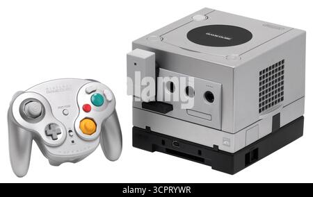 2001 silver Nintendo GameCube console with a silver Wavebird wireless controller and opitional Game Boy Player. Stock Photo